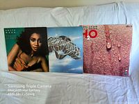 Three vinyl record album covers displayed side by side: Anita Baker, The Commodores, and Hall & Oates H2O