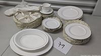 Full set of Royal Doulton Lacepoint bone china including storage box for cups and various plates.