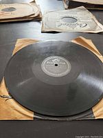 Top view of black 78 RPM vinyl record on brown paper sleeve showing RCA Victor label in the center.