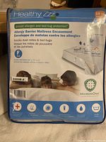Front packaging of Healthy Zzz Allergy Barrier Mattress Encasement showing product details and size (Full, 54" x 75" x 17") and features (blocks dust mites and bed bugs).