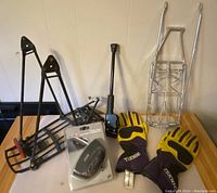 Overall lot showing bike racks, motorcycle stand, gloves, and power outlet
