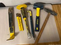 All six tools arranged horizontally showing brands and condition