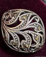 Close-up of the ring top showing marcasite stones and detailed filigree silver work.