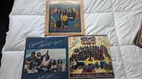 Three classic rock vinyl LP albums with their album covers showing. Includes Chilliwack double LP, Quicksilver Messenger Service, and Procol Harum.