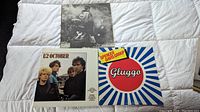 Three vinyl LP album covers, U2 October on the left, The Who double album top center, Spencer Davis Group Gluggo right
