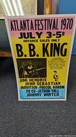 Full view of the poster showing event title, dates, headliners, performer list, and gradient background colors with Jimi Hendrix photo.