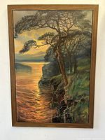 Full view of the oil painting showing the sunset over the river bend framed in wood