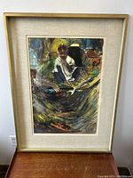 Full view of framed watercolor painting showing a seated child amidst dynamic brush strokes.