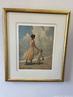 Full view of framed limited edition art print showing woman and child by the seaside, signed and numbered.