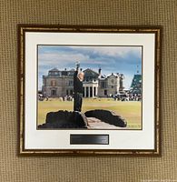 Framed color photo of Arnold Palmer on the Swilcan Bridge waving to fans at the 1995 British Open with clubhouse in background