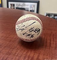 Baseball showing Bo Jackson's signature and number in black ink on a worn surface.