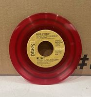 Red colored 45rpm vinyl record with label 'My Way' by Elvis Presley on RCA Victor label, stereo version with handwritten marking.