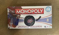Top view of factory sealed Montreal Canadiens Monopoly board game box with team branding and logo.