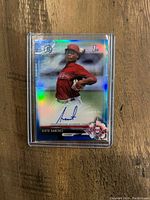 Single photo showing a Sixto Sanchez Bowman Chrome rookie autograph baseball card in blue parallel, numbered 150, in a hard plastic protector.