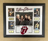 Full view of framed Rolling Stones collage wall art showing central group photo, band title, tongue logo and four individual photos with signature plaques