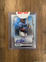 Photo of Bowman Sterling Wander Franco autograph rookie card in plastic case with Topps seal.