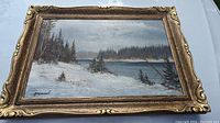 Full view of framed winter landscape oil painting by M.F. Kousal showing signature and detailed scene with snow, trees, and water.