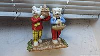 Front view of the Rupert Bear and Algy Pug figurine showing both characters and base