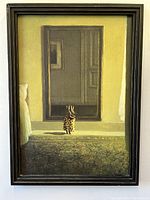 Frontal view of the framed art print showing the rabbit in front of the mirror scene within the black frame.