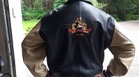 Back of jacket showing large embroidered castle and Mickey patch reading 'Fifty Years Est. 1955'