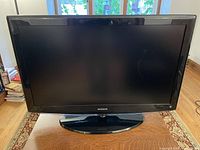 Front view of Samsung 40-inch TV on stand showing screen and bezel