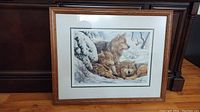 Framed print titled "On Watch" by R M Condon depicting wolves in snow.