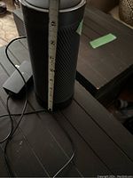 Photo showing the approximate height of the cylindrical Harman/Kardon Bluetooth speaker (~9 inches).