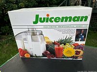 Box front showing Juiceman brand and professional series 210 juicer image with fresh fruits and vegetables.