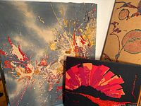 Overview of two textile art pieces mounted on walls showcasing colors and patterns