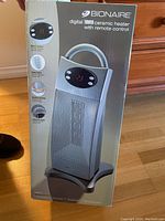 Box of Bionaire digital tower ceramic heater showing front view with product image, brand, and key features.