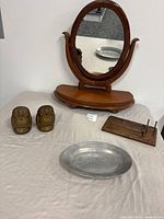 Group shot showing mirror, brass owl bookends, metal tray, wood letter holder