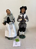 Front view of both Byers' Choice pilgrim figurines