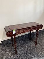 Full view of rosewood console table against wall
