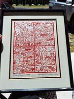Full view of the framed linocut artwork showing four panel design with red ink on white paper, signed and dated at the bottom.