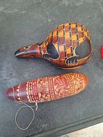 Top view of the pair of story gourds showing animal-shaped gourd and traditional patterned gourd