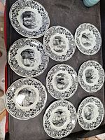 Nine Creil Montereau transferware plates arranged to show front decoration and size.