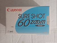 Original Canon Sure Shot 60 Zoom Date camera box, white and blue, with Canon branding