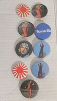 Front view of all eight buttons showing different designs including characters, logo and Rising Sun flags from The Karate Kid movie.