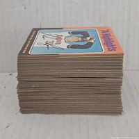 Stacked side view of cards showing thickness and edge wear