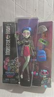 Front view of the Monster High Ghoulia Yelps doll in the box showing the doll and included accessories