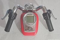 Front view of Radica Harley Davidson Road Rally handheld game showing handlebar grips and central LCD screen