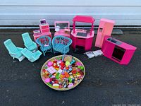 Full view of all furniture pieces with a large round tray holding numerous miniature food items placed in front