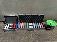 Wide view of both poker chip sets and the vintage spinning poker chip rack.