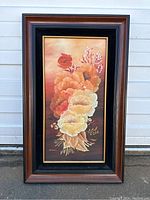 Full front view of the framed floral still life painting showing flowers in warm tones and signature Anderson.