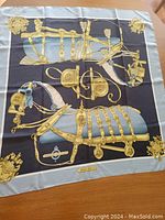 Full view of scarf laid flat on table showing complete horse regalia design