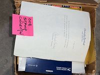 Documents and letters related to the stamp collection, with receipts and certifications included.
