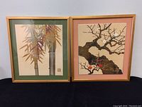 Pair of framed Japanese mixed media artworks, one bamboo, one plum blossom, showing colors and framing