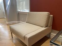 Front-side view showing seat cushion, backrest, armrests and chrome legs