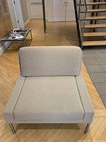 Front view of chair showing seat and back cushions