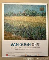 Plaque-mounted Van Gogh art poster titled 'Field of Iris' with museum and gallery details at bottom.